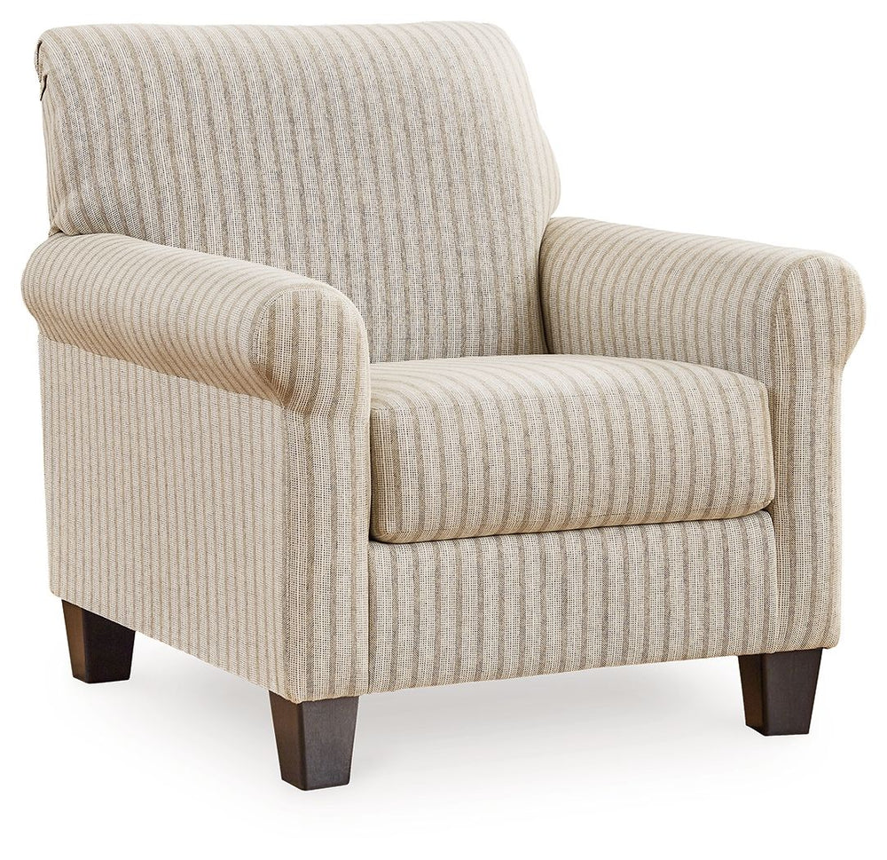 Seeking simple, transitional style? Enter this accent chair. Its commitment to carefree comfort is right at home with your relaxed living room aesthetic. A classic striped pattern elevates the everyday charm of the neutral fabric, while the deep, plush se