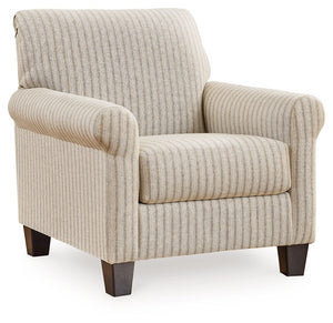 Seeking simple, transitional style? Enter this accent chair. Its commitment to carefree comfort is right at home with your relaxed living room aesthetic. A classic striped pattern elevates the everyday charm of the neutral fabric, while the deep, plush se