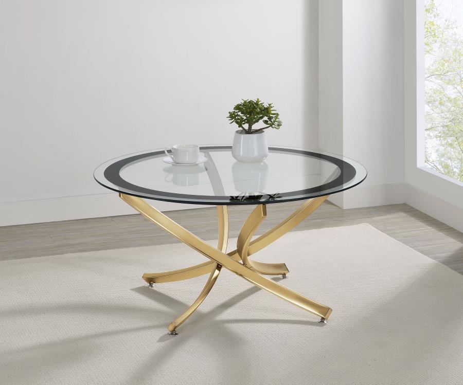 Infuse your living space with the warmth of a contemporary coffee table, designed to harmoniously blend modernity and comfort. The artfully curved, crisscrossing metal base is electroplated for a lustrous finish, supporting a clear tempered glass top enci