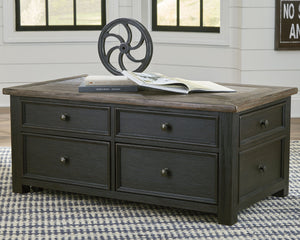  this lift-top coffee table is all the talk of todayâ€™s design world. Wood grain shows through the weathered gray-brown top in all of its earthy pleasure. The framed drawers