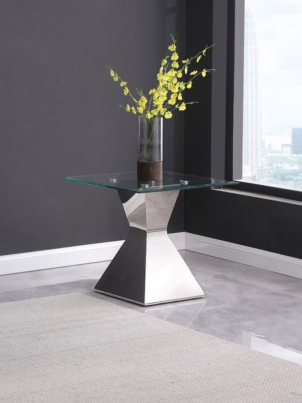  showcasing an hourglass-inspired base in a polished silver finish. Constructed with stainless steel and tempered glass