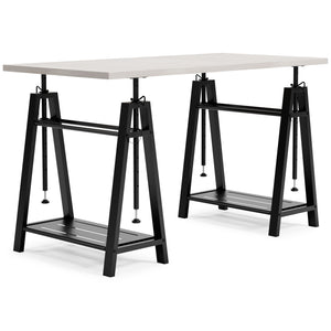 Love an urban farmhouse aesthetic? Make it work to your advantage with this beautifully styled home office desk. A simply striking choice in home office furniture, it has an unmistakable farmhouse feel thanks to design elements including a whitewashed fin