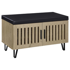 This modern storage bench combines style and functionality, featuring a faux leather upholstered padded top for added versatility as a seating bench. The cabinetâ€™s two doors showcase a vertical slat design, enhancing its contemporary aesthetic while all