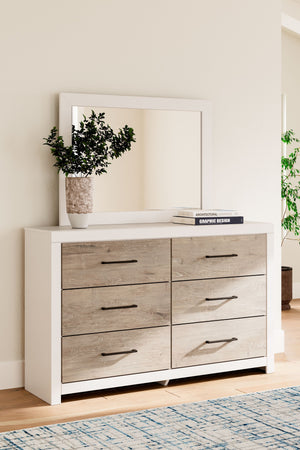  light finish with replicated oak grain and authentic touch. Cases feature a framed front and pilasters. Contemporary handles in an antiqued gunmetal finish. Side roller glides for smooth operating drawers. Dr