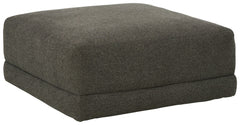 Architecturally inclined with its gently curving profile, this oversized accent ottoman is stunning from all angles. Acting as the focal point in a neutral space, the granite-hued upholstery also creates a blank canvas for adding pops of color.<br><br><b>