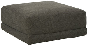 Architecturally inclined with its gently curving profile, this oversized accent ottoman is stunning from all angles. Acting as the focal point in a neutral space, the granite-hued upholstery also creates a blank canvas for adding pops of color.<br><br><b>