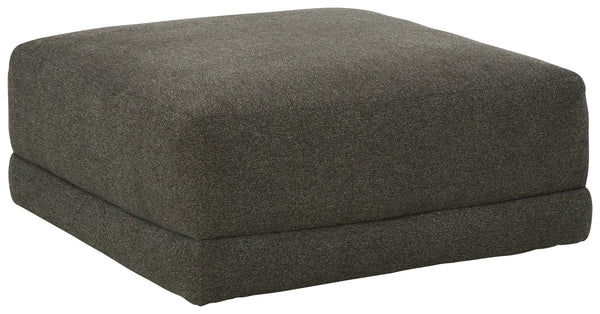 Architecturally inclined with its gently curving profile, this oversized accent ottoman is stunning from all angles. Acting as the focal point in a neutral space, the granite-hued upholstery also creates a blank canvas for adding pops of color.<br><br><b>