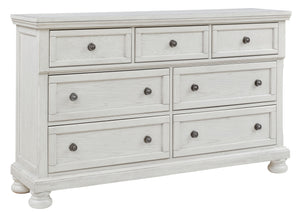 Elegant, timeless furnishings take your bedroom to the next level. Nothing does that better than this dresser. The antiqued white finish with a wonderful grain texture radiates sophistication, while the dark bronze-tone hardware adds an ornate touch. A hi