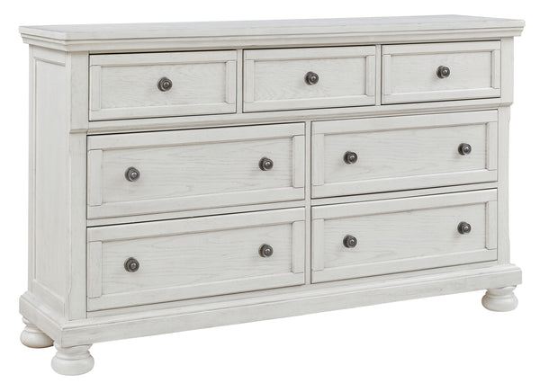 Elegant, timeless furnishings take your bedroom to the next level. Nothing does that better than this dresser. The antiqued white finish with a wonderful grain texture radiates sophistication, while the dark bronze-tone hardware adds an ornate touch. A hi