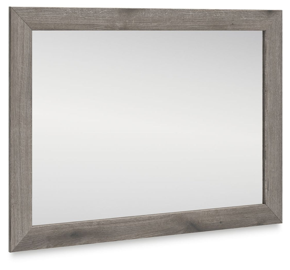 Combining a casual aesthetic with functional flair, this bedroom mirror suits styles from rustic to industrial. In a chic weathered gray hue, it brings a charmingly curated vibe to your morning and nighttime routines. Stage it as you pleaseâ€”this mirror 