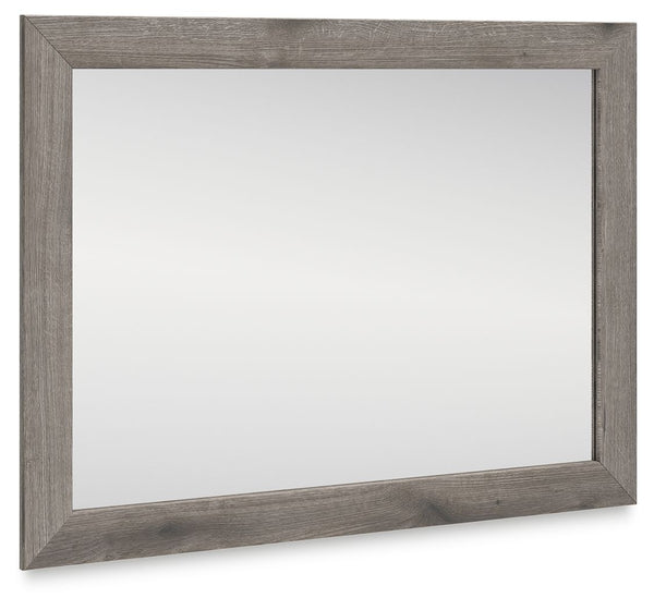 Combining a casual aesthetic with functional flair, this bedroom mirror suits styles from rustic to industrial. In a chic weathered gray hue, it brings a charmingly curated vibe to your morning and nighttime routines. Stage it as you pleaseâ€”this mirror 