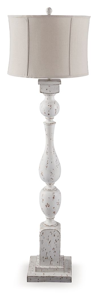 This floor lamp takes a classic approach to tasteful lighting. Its detailed base ushers an air of elegance into your space with a graceful turn design. Outfitted with an antiqued white finish, it-'s right at home in traditional spaces. Pair with the match