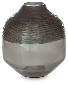 The accent is on contemporary with this exquisite glass vase. Its cool iridescent gray finish and hand-carved pattern deliver a sophisticated statement wherever you like. For those with an artful eye and a love of modern elegance, it-'s a beauty to behold