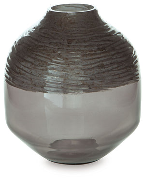 The accent is on contemporary with this exquisite glass vase. Its cool iridescent gray finish and hand-carved pattern deliver a sophisticated statement wherever you like. For those with an artful eye and a love of modern elegance, it-'s a beauty to behold