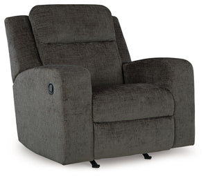 Indulgent comfort meets fashion-forward flair in this rocker recliner. Its luxuriously soft upholstery and captivating color show off your cozy yet smart style. Sleek track arms infuse a modern sensibility, while the gentle rocking motion makes this piece