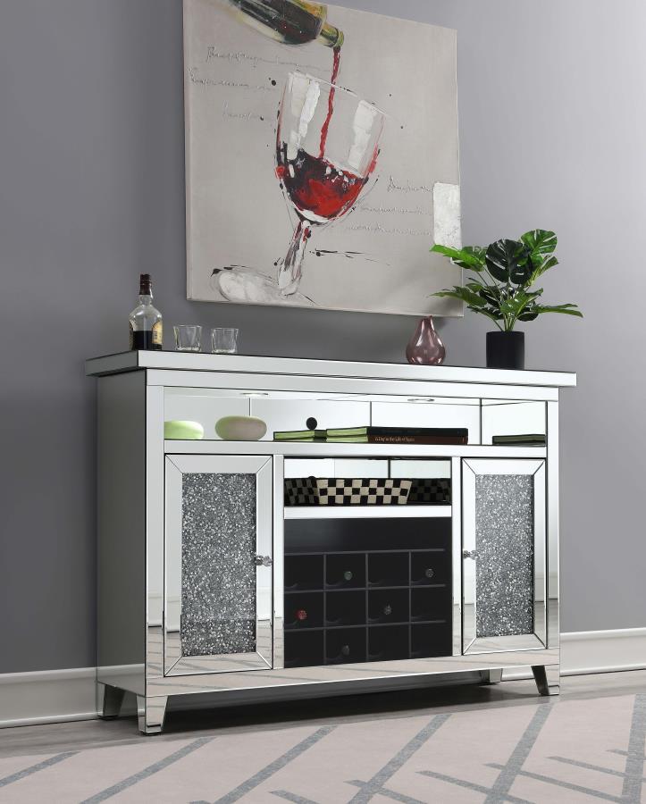 Create a breathtaking focal wall for your dining space with this stunning modern glam wine cabinet. Spacious and sparkling, this wonderful wine cabinet boasts glamorous elements like mirror tile and trim and a faux diamond inlay for a luxurious look and f