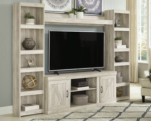 Express your modern farmhouse style with this entertainment center. Its wispy white finish over replicated oak grain is a delightful change from the ordinary. Clean-lined, classic styling with barn door inspiration provides a country-chic aesthetic thatâ€