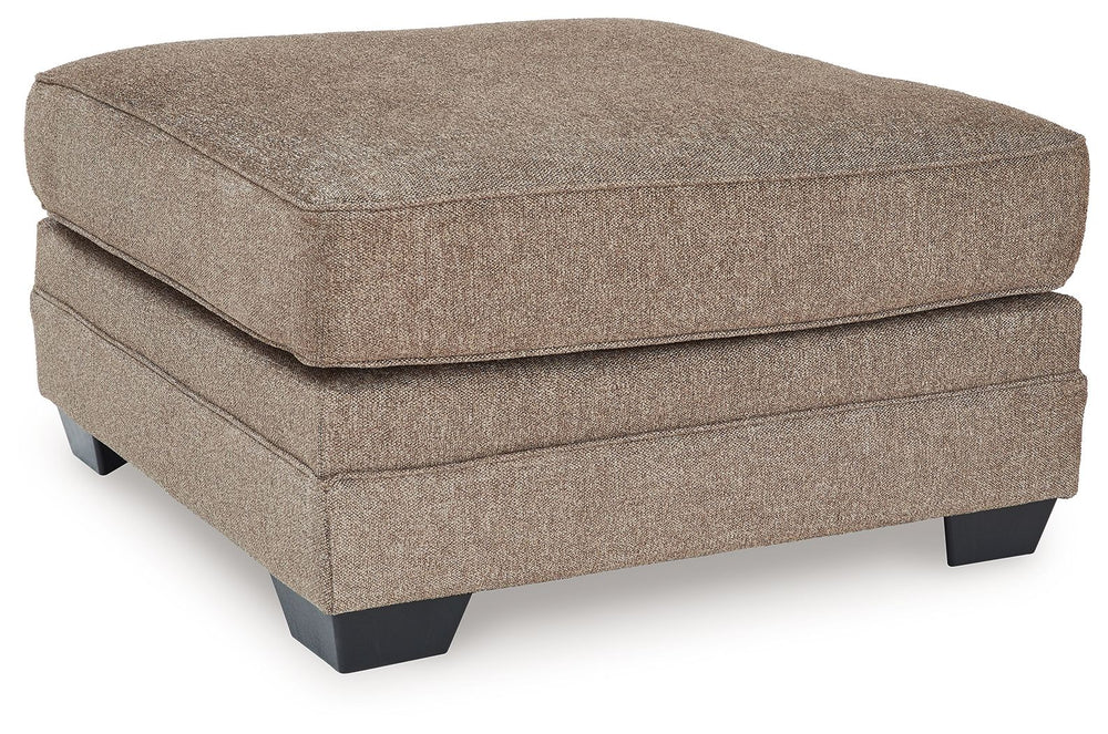 Classic, contemporary and cozy. With this ottoman, relaxing in style is made easy. It takes a warm and inviting approach to versatile color, incorporating posh character into your space with menswear-inspired upholstery. Living room lounging has never bee