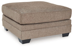 Classic, contemporary and cozy. With this ottoman, relaxing in style is made easy. It takes a warm and inviting approach to versatile color, incorporating posh character into your space with menswear-inspired upholstery. Living room lounging has never bee