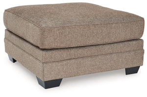Classic, contemporary and cozy. With this ottoman, relaxing in style is made easy. It takes a warm and inviting approach to versatile color, incorporating posh character into your space with menswear-inspired upholstery. Living room lounging has never bee
