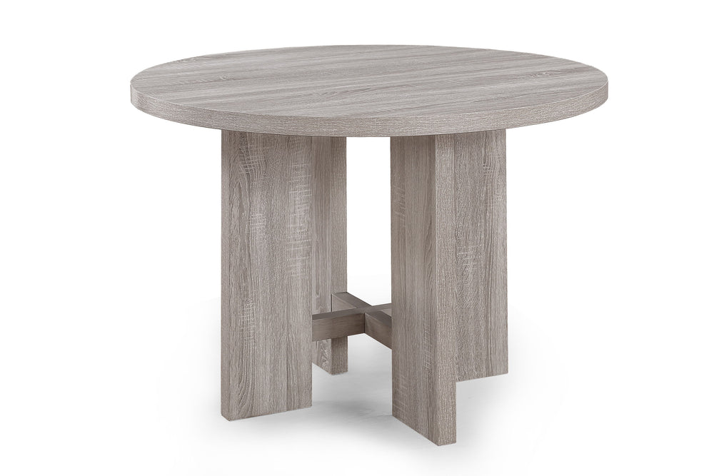 This charming dining set exudes a coastal-inspired aesthetic, perfect for creating a light and airy dining atmosphere. The set centers around a round table with a weathered wood finish, offering a casual yet refined dining surface that invokes a sense of 