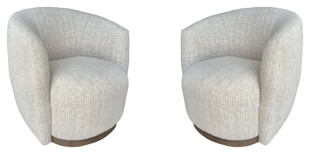 The stylish and comfortable Tatum accent chair features a 360-degree swivel for easy movement and a charcoal finish wood surround base for a modern look. The cozy club chair design with shelter arms contains an integrated seat cushion providing a relaxing