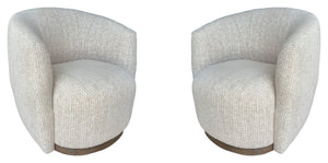 The stylish and comfortable Tatum accent chair features a 360-degree swivel for easy movement and a charcoal finish wood surround base for a modern look. The cozy club chair design with shelter arms contains an integrated seat cushion providing a relaxing