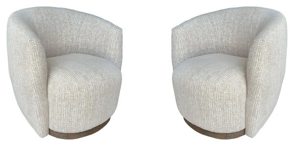 The stylish and comfortable Tatum accent chair features a 360-degree swivel for easy movement and a charcoal finish wood surround base for a modern look. The cozy club chair design with shelter arms contains an integrated seat cushion providing a relaxing