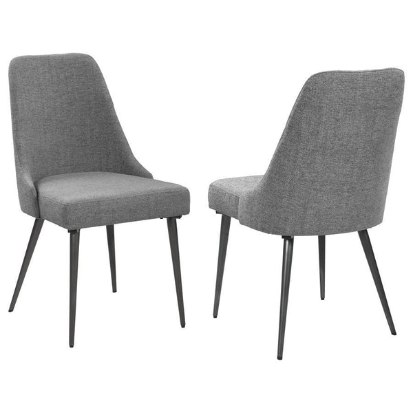 Channel mid-century charm with this armless side chair, wrapped in soft textured grey fabric. Its sleek wingback-inspired profile and gently tapered gunmetal legs bring a fresh, modern edge to dining spaces. Padded for comfort and built with durable mater
