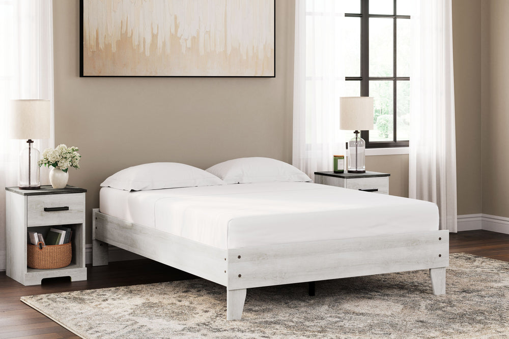 Give provincial a new meaning with the chic look of this full platform bed. The whitewash distressed finish keeps this piece light and fresh, as does its minimalist aesthetic.<br><br><b>Additional Dimensions</b><br><ul><li>Rail to floor: 7.25-"</li><li>As