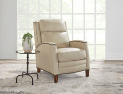 The Vermont power recliner offers a luxurious and effortless power pushback recline feature, allowing you to easily find the most comfortable position for relaxation. It is upholstered in soft leather with custom matching and features decorative nail head