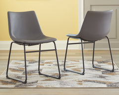 With its distinctive contoured bucket seat and tubular metal base, this dining chair serves up a fresh twist on mid-century inspired style. Chic gray faux leather upholstery adds to the aesthetic. What a timeless look for eat-in kitchens and casually cool