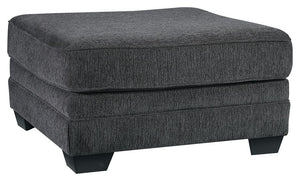 The ultimate sectional centerpiece, this oversized ottoman is big on cool, contemporary style and long on comfort. Plushly upholstered in a slate gray fabric, this ottoman is so generously scaled, you can top it with a serving tray and still have plenty o