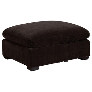 With the easy style of ultra-modern living, the ottoman delivers a streamlined motif with ultimate versatility. A classic layered design offers plush, plump aesthetics merged with a boxy, wood-constructed base. Smooth fabric upholstery covers wood framing