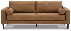 Small-scale style, tailored to perfection. This sofa echoes retro aesthetics with warm caramel faux leather, while its ultra-linear silhouette incorporates a contemporary edge. Versatile in form and function, the seat suits styles from modern boho to tran