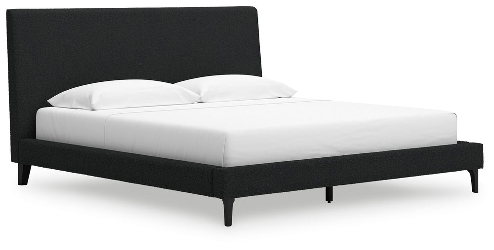 This king upholstered bed reflects your sophisticated approach to boho style. Crafted with both form and function in mind, its black boucle fabric brings trend-right beauty to bedtime. The versatile design suits all-neutral spaces or blends with your favo