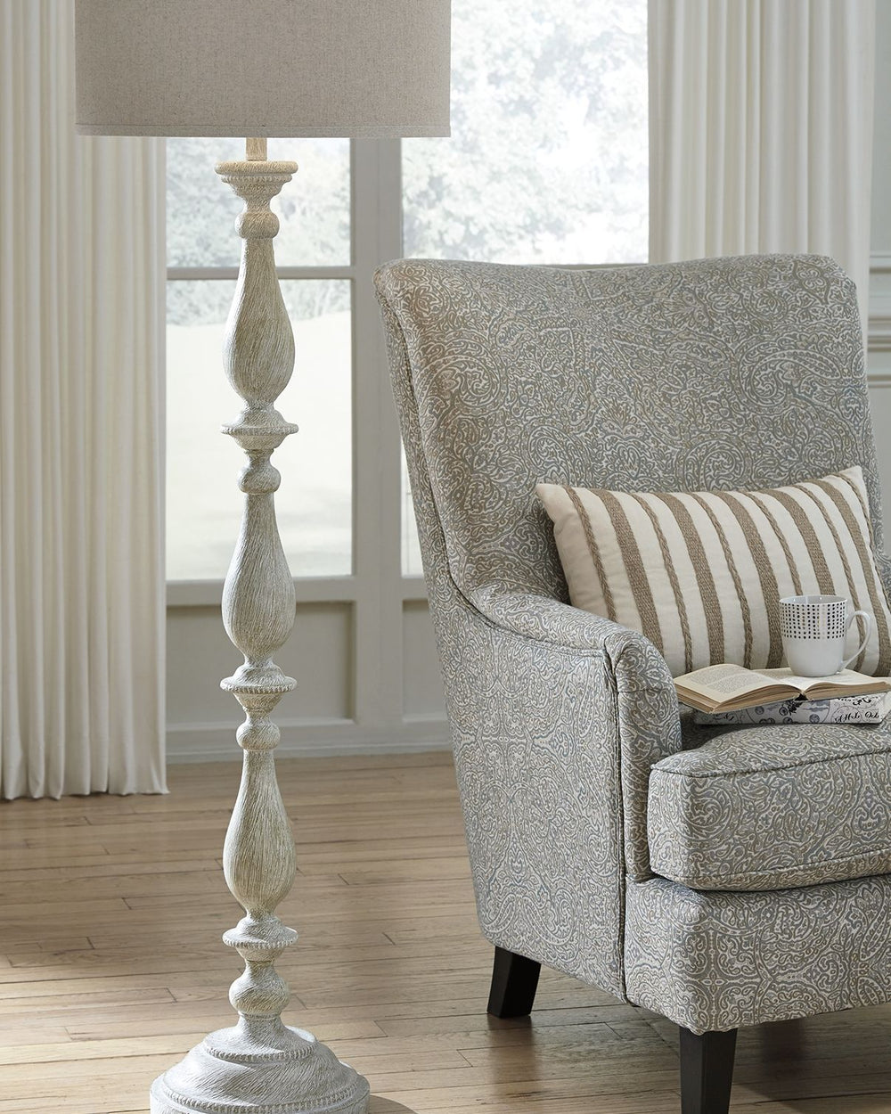 With its whitewash finish, this floor lamp is full of character and style. Its candlestick design and drum shade will add a dose of casual chicness to your living space.<br><br><b>Additional Dimensions</b><br><ul><li>Shade: 0-"</li><li>Base: 0-"</li><li>C