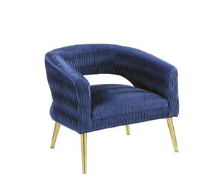Fill your empty corner with tempting textures and stylish elements. Four splayed legs in a gold finish give the chair a gorgeous glam look. The barrel style backrest provides you a comfortable support and a soft velvet covers all possible contact area. Us