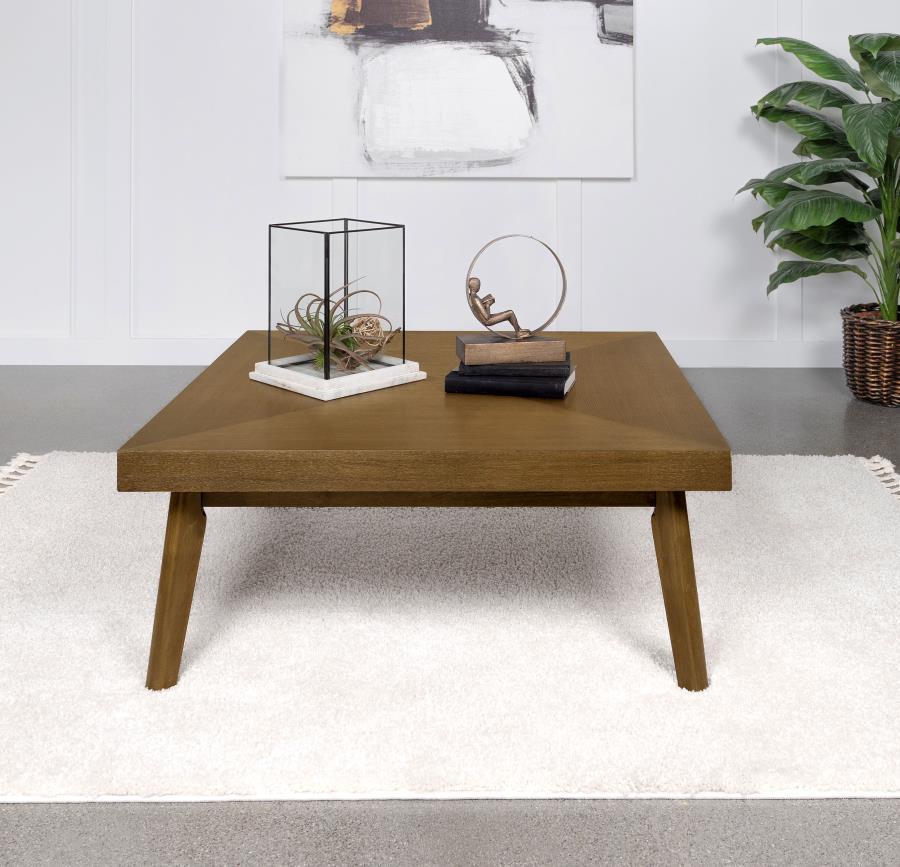 In the heart of the living space, this coffee table commands attention with its bold top and a walnut brown finish that captivates with its depth. The veneer parquet top is a celebration of craftsmanship, displaying a geometric dance of wood grains that c