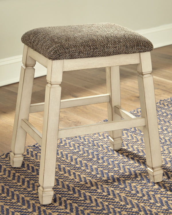  this backless bar stool entices with a saddle seat covered in a heavy woven fabric that complements the antiqued white finish.<br><br><b>Additional Dim