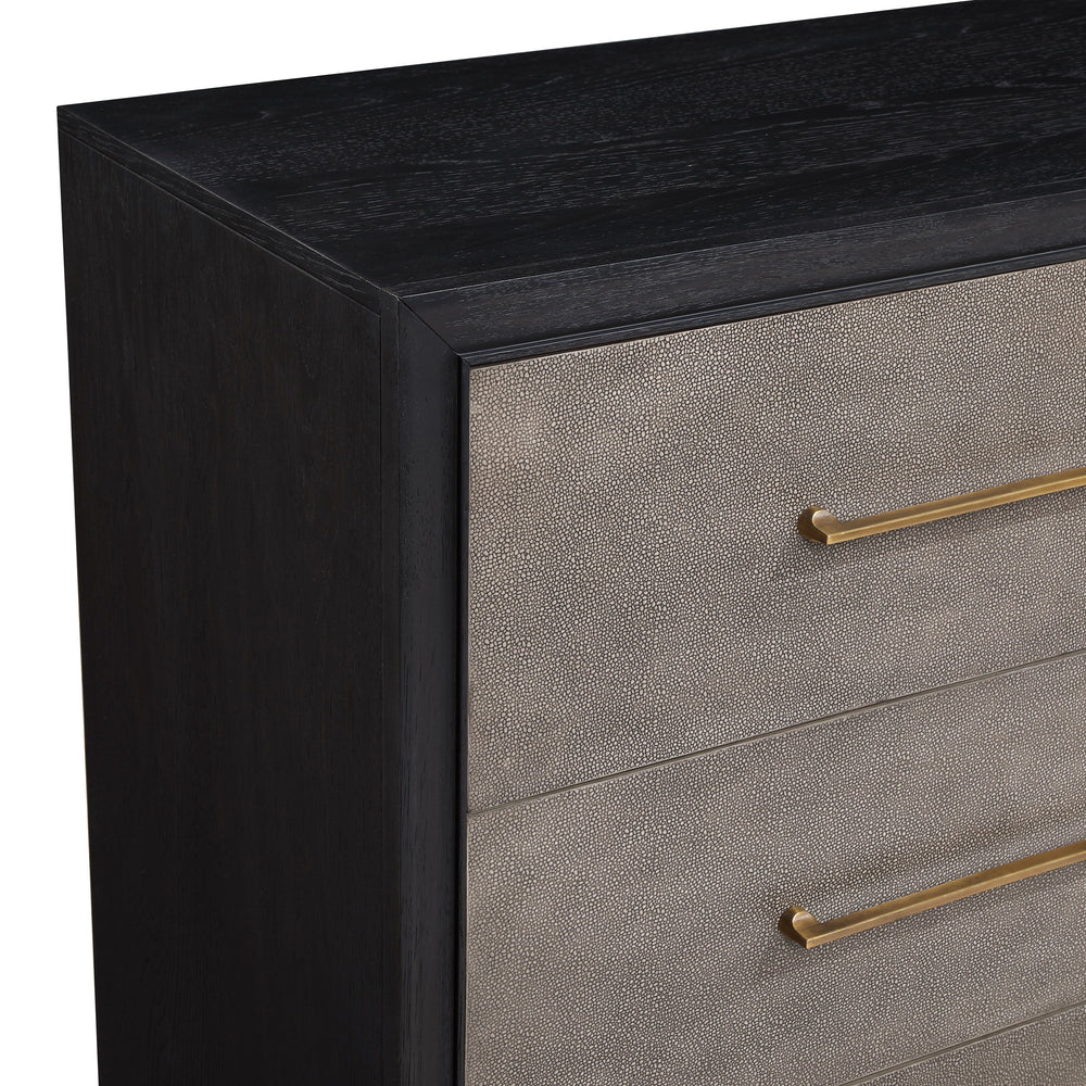 This bedroom ensemble exudes a sleek, contemporary charm with a hint of mid-century flair, perfect for creating a tranquil yet stylish retreat. The centerpiece, a bed with an upholstered headboard, is framed with a contrasting dark trim, offering a plush 