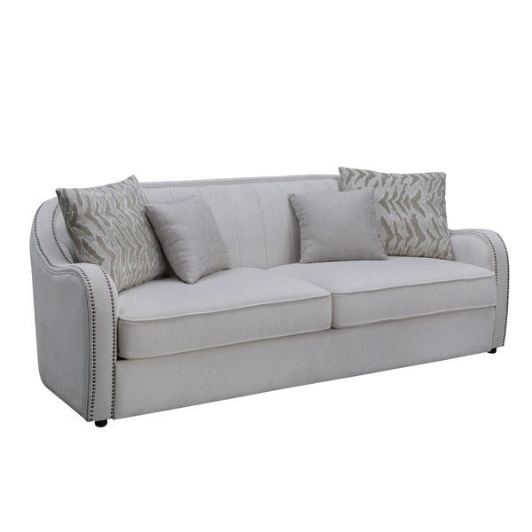 Create a clean, contemporary look with the gently curved Mahler living room set. The inner wooden frame and block plastic legs offer maximum support. Upholstered in a beige textured linen fabric and outlined with nailhead trim. The barrel seat and sloping