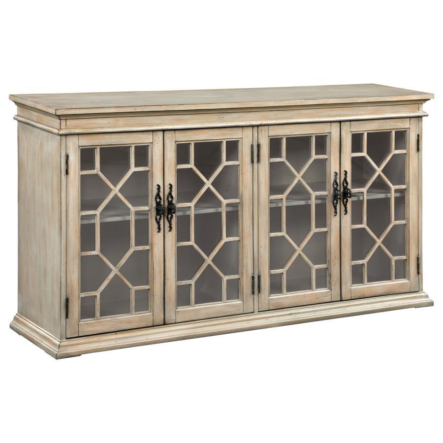 Add rustic charm and timeless elegance to your home with this farmhouse-inspired accent cabinet. A warm honey-toned finish and weathered detailing give it a country-style appeal, while decorative glass panel doors with intricate trim add a refined touch. 