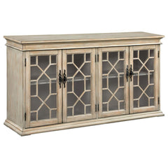 Add rustic charm and timeless elegance to your home with this farmhouse-inspired accent cabinet. A warm honey-toned finish and weathered detailing give it a country-style appeal, while decorative glass panel doors with intricate trim add a refined touch. 