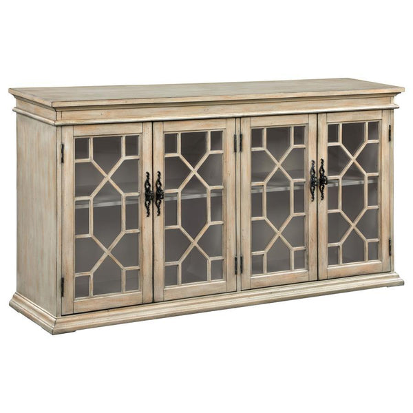 Add rustic charm and timeless elegance to your home with this farmhouse-inspired accent cabinet. A warm honey-toned finish and weathered detailing give it a country-style appeal, while decorative glass panel doors with intricate trim add a refined touch. 