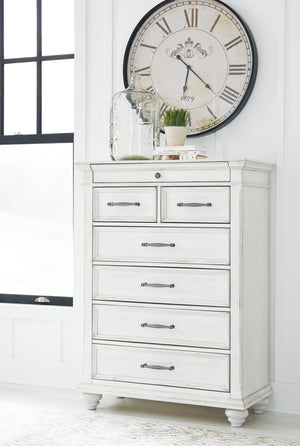  it includes seven varied-sized drawers for an organized wardrobe. Generously scaled moulding from top to bottom