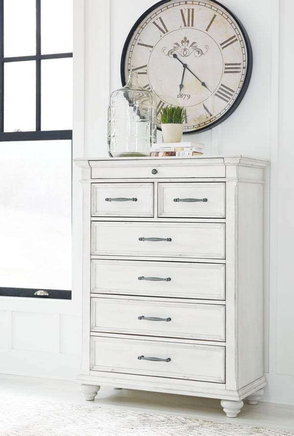  it includes seven varied-sized drawers for an organized wardrobe. Generously scaled moulding from top to bottom