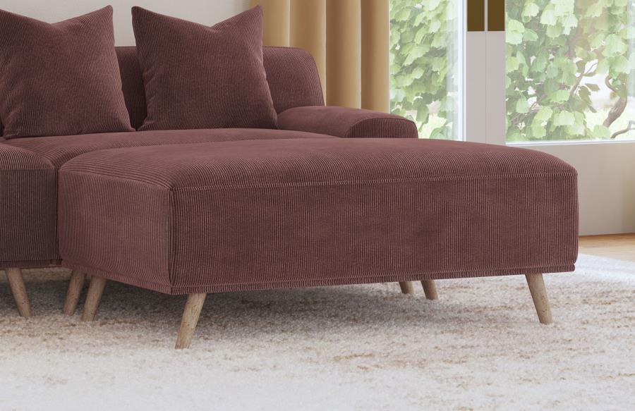 Complete your inviting sitting area with the richness of a modern ottoman. It showcases red wine upholstery, adding depth and the richness of a lovely jewel tone to your living room. It features a rectangular silhouette with plush padding, offering a foot