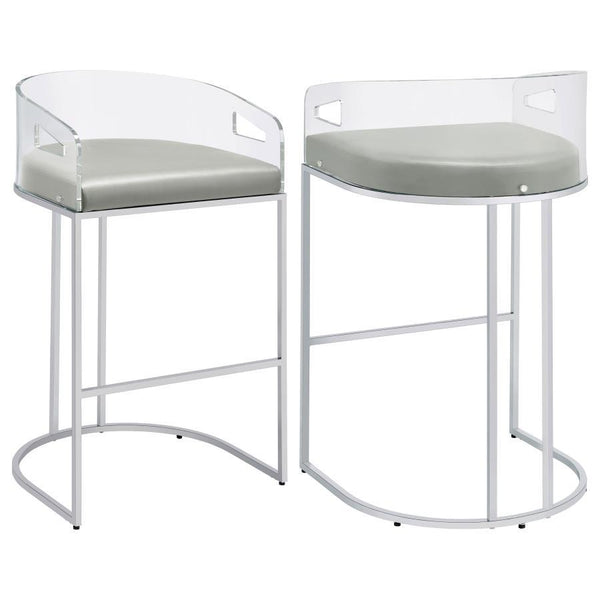 Ultra-modern with a retro-inspired vibe, this pair of stools make a striking piece to a dining room space. With a curved backrest in a clear acrylic material, each stool offers an open and airy design. Rest comfortably on a leatherette cushion as you dine