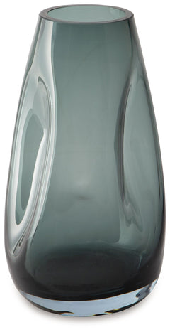 Sleek. Contemporary. Chic. This vase has an organic sense of movement, recalling seaside aesthetics with its teal glass. A stunning solo accent, it also acts as a beautiful vessel for florals and other decorative fillers. And the vase is safe for outdoor 